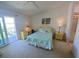Bright bedroom with a balcony, a double bed, and an ensuite bathroom at 324 Madeira Cir, Tierra Verde, FL 33715