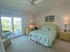 Comfortable bedroom with a queen-size bed and access to a private balcony at 324 Madeira Cir, Tierra Verde, FL 33715