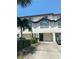 Two-story townhouse with attached garage at 324 Madeira Cir, Tierra Verde, FL 33715