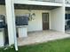 Private patio with tile flooring and exterior access at 324 Madeira Cir, Tierra Verde, FL 33715