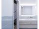 Contemporary bathroom with light blue tile and floating vanity at 2170 Robinhood Street # C2-302, Sarasota, FL 34231