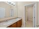 Spacious bathroom with double sinks, wood cabinets, and a separate shower area at 6309 75Th E Ave, Palmetto, FL 34221