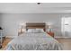 Bedroom featuring a bed with wood headboard, bedside tables, and laminate floors at 6309 75Th E Ave, Palmetto, FL 34221