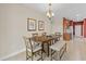Dining room featuring a wood table with seating and stylish decor at 6309 75Th E Ave, Palmetto, FL 34221