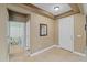 Inviting entryway with tiled flooring, a decorative mirror, and neutral paint tones at 6309 75Th E Ave, Palmetto, FL 34221