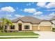 Charming single-story home with well-maintained landscaping, a two-car garage, and inviting curb appeal at 6309 75Th E Ave, Palmetto, FL 34221