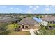 An attractive single-Gathering home has a well-manicured lawn and a tranquil view of the adjacent lake at 6309 75Th E Ave, Palmetto, FL 34221
