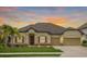 Inviting single-story home featuring a well-manicured lawn and an attached two-car garage at 6309 75Th E Ave, Palmetto, FL 34221
