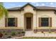 Charming single-Gathering home features manicured landscaping, decorative stone accents, and a covered front porch at 6309 75Th E Ave, Palmetto, FL 34221