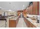 Stylish kitchen with granite countertops, stainless appliances, and seating at the breakfast bar at 6309 75Th E Ave, Palmetto, FL 34221