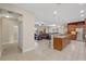 Open-concept kitchen boasts granite countertops, stainless steel appliances, and a breakfast bar at 6309 75Th E Ave, Palmetto, FL 34221
