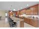 Chef's kitchen featuring granite counters, ample cabinets, and bar seating at 6309 75Th E Ave, Palmetto, FL 34221