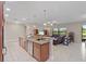 Open kitchen with breakfast bar seamlessly connects to the inviting living area at 6309 75Th E Ave, Palmetto, FL 34221