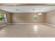 Spacious living room featuring neutral paint, beautiful tile floors, and natural light at 6309 75Th E Ave, Palmetto, FL 34221