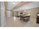 Bright and airy living room and dining area with neutral walls, tile flooring, and modern lighting at 6309 75Th E Ave, Palmetto, FL 34221