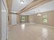 Bright and airy living room featuring neutral walls, tile flooring, and modern lighting at 6309 75Th E Ave, Palmetto, FL 34221