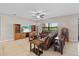 Cozy living room featuring comfortable seating, media center, and a large window with natural light at 6309 75Th E Ave, Palmetto, FL 34221