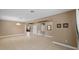Spacious living room with neutral walls and tile flooring provides a comfortable gathering space at 6309 75Th E Ave, Palmetto, FL 34221