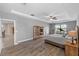 Spacious bedroom with a ceiling fan, laminate floors, and large windows at 6309 75Th E Ave, Palmetto, FL 34221