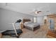 Spacious bedroom with a ceiling fan, laminate floors, and large windows at 6309 75Th E Ave, Palmetto, FL 34221