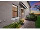 Townhome's front entrance with stone accents and landscaping at 6056 Worsham Ln # 104, Lakewood Ranch, FL 34211