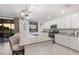 Island kitchen with granite countertops, stainless steel appliances, and access to a patio at 6056 Worsham Ln # 104, Lakewood Ranch, FL 34211