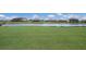 Homes overlooking a lake and golf course at 6056 Worsham Ln # 104, Lakewood Ranch, FL 34211