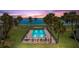 Community pool with ocean view at sunset at 4660 Ocean Blvd # Q2, Sarasota, FL 34242