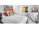 Spacious bedroom with white bedding and colorful pillows at 4660 Ocean Blvd # Q2, Sarasota, FL 34242