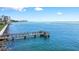 Wooden community dock extending into the water at 4660 Ocean Blvd # Q2, Sarasota, FL 34242