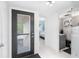 Bright entryway with modern door and views into living spaces at 4660 Ocean Blvd # Q2, Sarasota, FL 34242