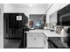 Sleek kitchen with black appliances and white countertops at 4660 Ocean Blvd # Q2, Sarasota, FL 34242