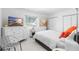Serene bedroom with white dresser and gray chair at 4660 Ocean Blvd # Q2, Sarasota, FL 34242