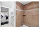 Simple bathroom with a shower and tiled walls at 4660 Ocean Blvd # Q2, Sarasota, FL 34242