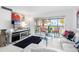 Living room with water views and balcony access at 4660 Ocean Blvd # Q2, Sarasota, FL 34242