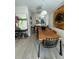 Dining room with modern lighting, stylish art, and a table with seating for eight at 5023 Inverness Dr, Sarasota, FL 34243