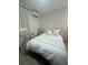 Serene bedroom features a plush bed, elegant decor, and access to natural light at 5023 Inverness Dr, Sarasota, FL 34243