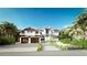 Stunning two-story home with a double garage and manicured landscaping at 4544 Woodside Rd, Sarasota, FL 34242