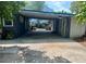 Covered carport with access to backyard garden at 5023 Inverness Dr, Sarasota, FL 34243