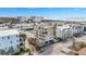 Aerial view of a new construction development, featuring multiple buildings and a tennis court at 1150 Windsong Ln # 300, Sarasota, FL 34242