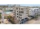Aerial view of a building under construction near a pool and other buildings at 1150 Windsong Ln # 300, Sarasota, FL 34242