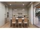 Modern kitchen with island, stainless steel appliances, and light wood cabinets at 1150 Windsong Ln # 300, Sarasota, FL 34242