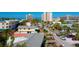 Charming neighborhood scene with lush greenery, various buildings, and a glimpse of the beautiful ocean at 1150 Windsong Ln # 300, Sarasota, FL 34242