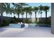 Inviting pool and spa with lounge chairs and tropical landscaping at 1150 Windsong Ln # 300, Sarasota, FL 34242