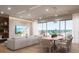 Open concept dining room with a large table and stunning ocean views at 1150 Windsong Ln # 400, Sarasota, FL 34242