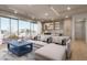 Spacious living room with a comfortable sectional sofa and large windows at 1150 Windsong Ln # 400, Sarasota, FL 34242