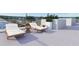 Relaxing rooftop deck with lounge chairs, offering city views at 1150 Windsong Ln # 400, Sarasota, FL 34242