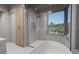 Spa-like bathroom with walk-in shower, soaking tub, and modern fixtures at 1150 Windsong Ln # 200, Sarasota, FL 34242