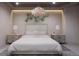 Bright bedroom with king bed, stylish wall art, and modern nightstands at 1150 Windsong Ln # 200, Sarasota, FL 34242