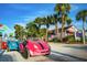 Three small cars parked in front of shops on a sunny day at 1150 Windsong Ln # 400, Sarasota, FL 34242